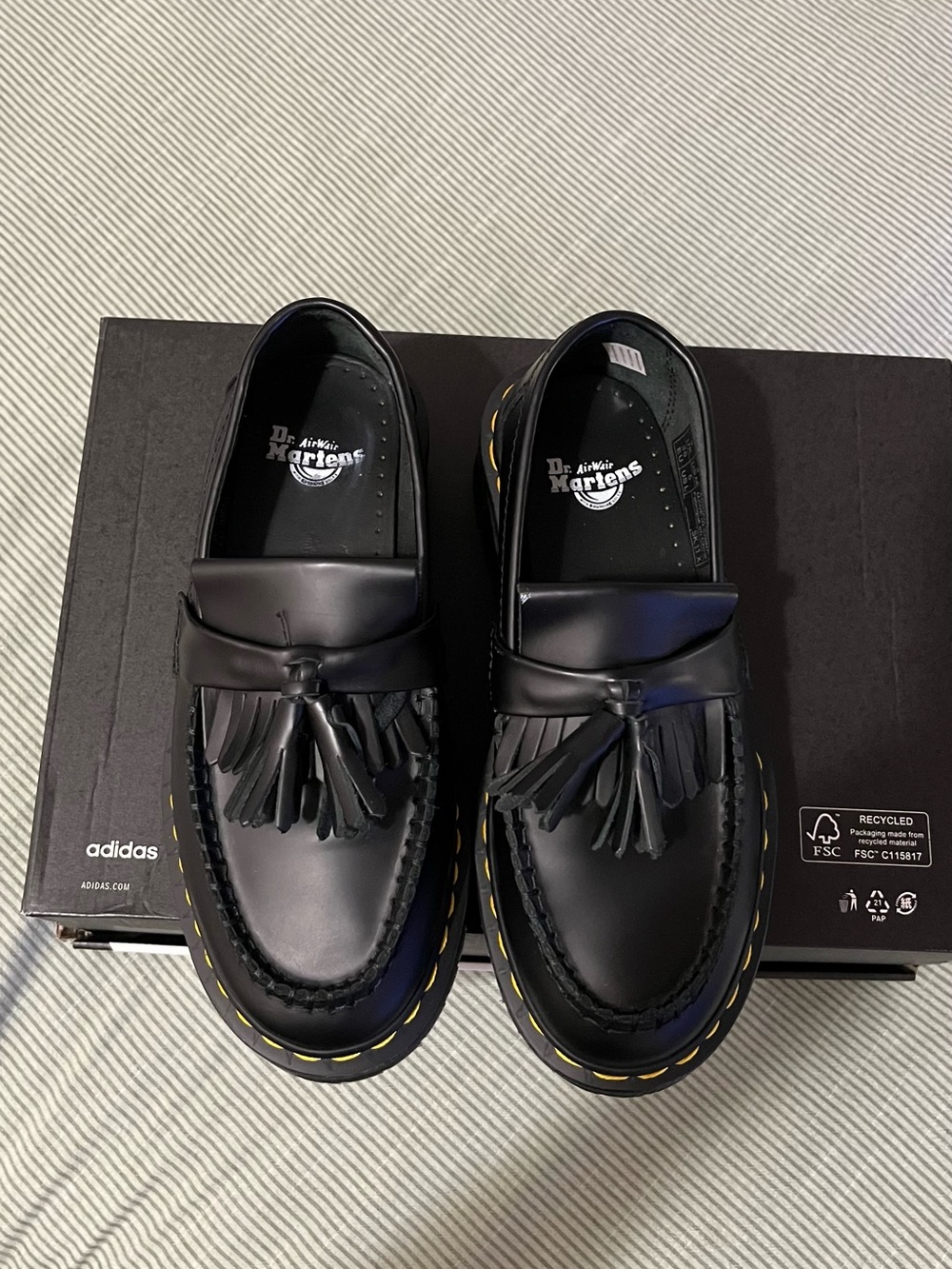 Dr. Martens Black Tassel Kiltie Loafers with Yellow Stitching